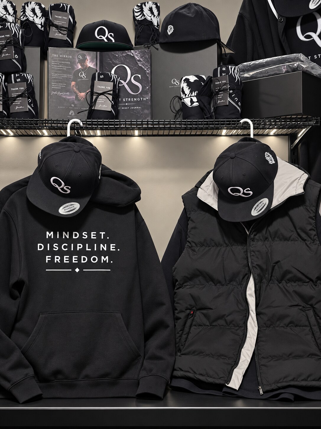 The Quiet Strength studio with books, apparel concepts and packaging